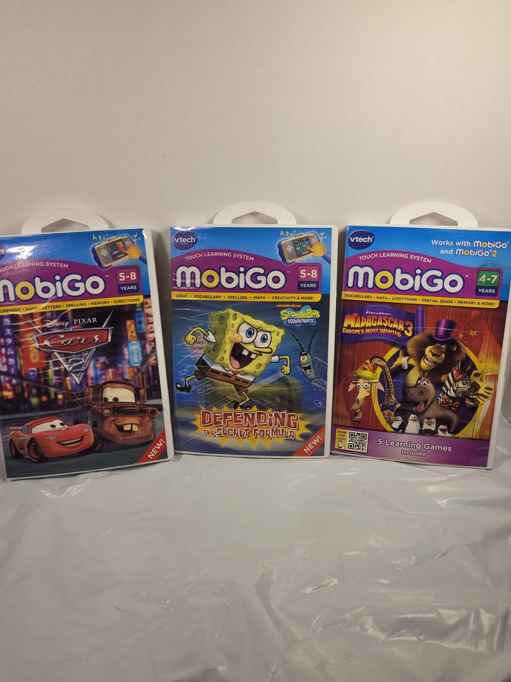 Lot Of 3 MobiGo Vtech Games Cars SpongeBob Madagascar (U)